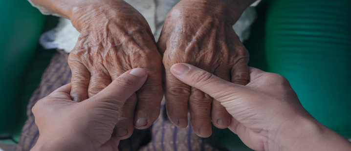young-woman-holding-an-elderly-woman-s-hand_2
